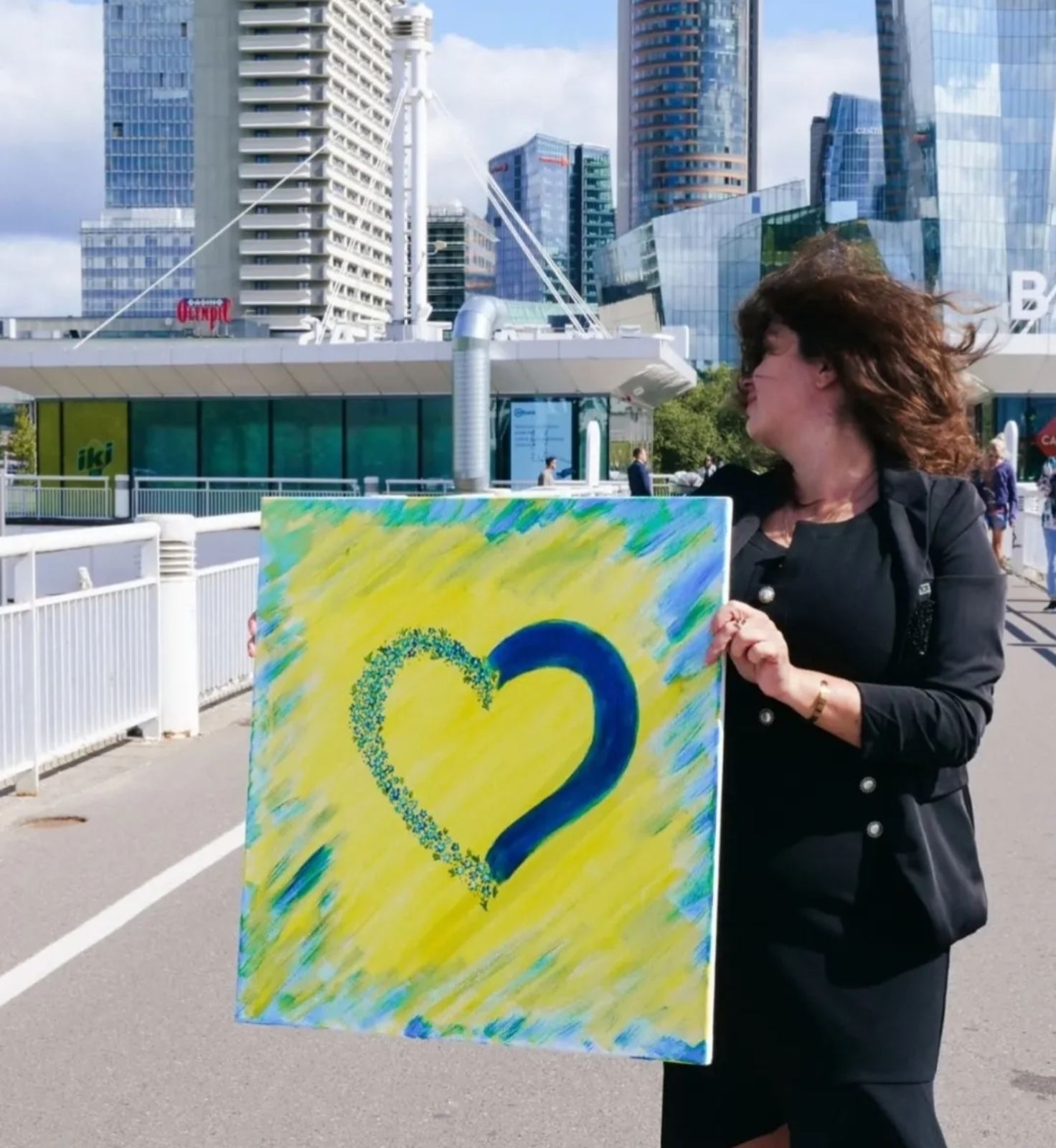 Khrystyna Havrylenko with painting in Vilnius